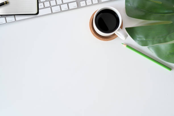 istock Office desk table with computer, office supplies, house plant, coffee cup and copy space. 1077880642