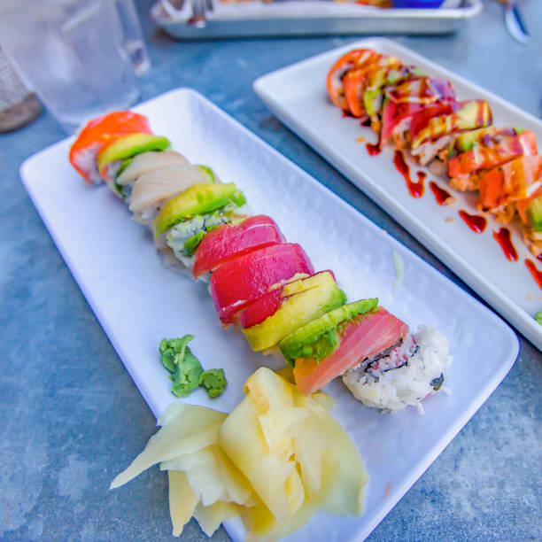 Plates of delicious seafood and vegetable sushi