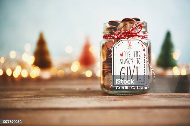Its The Season To Give Donation Jar With Money Stock Photo - Download Image Now - Christmas, Charity and Relief Work, Charitable Donation