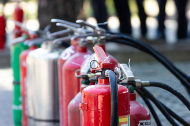 Close up Fire Safety Set Different Types of Extinguishers stock photo