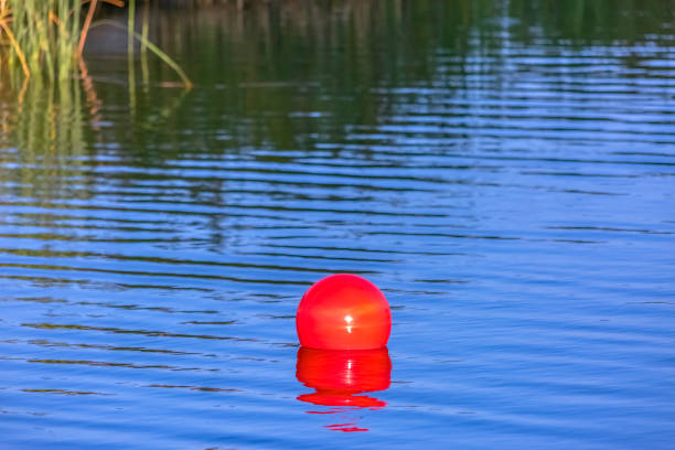 istock Red ball floating on Oquirrh Lake in Daybreak Utah 1077892062
