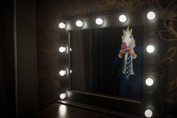 istock Glamour guy in elegant suit wearing mask 1077895802