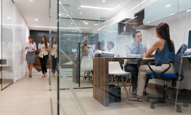 istock Group of business people at the office working on different things 1077900740