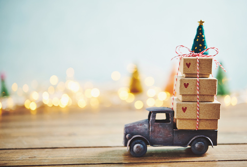 Cute little truck with gift stack and Christmas tree