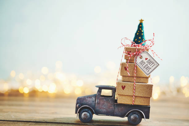 istock Cute little truck with gift stack and Christmas tree 1077901654