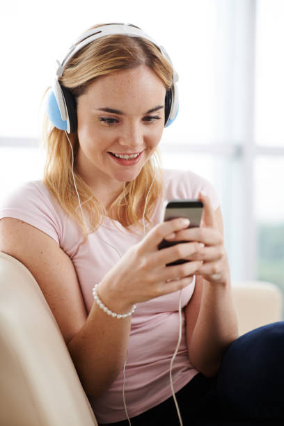 istock Enjoying music in smartphone 1077903732