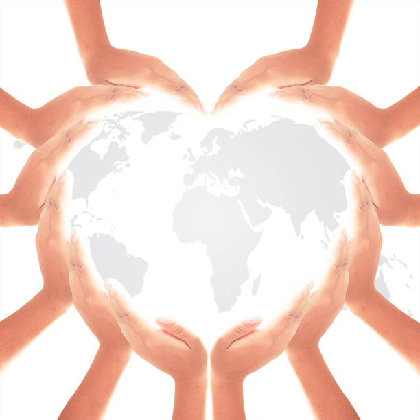 istock International human rights day concept: Human hands in hearth shape on white world map of clouds background 1077903990