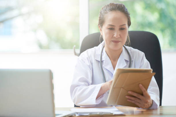istock Female doctor with digital tablet 1077909378