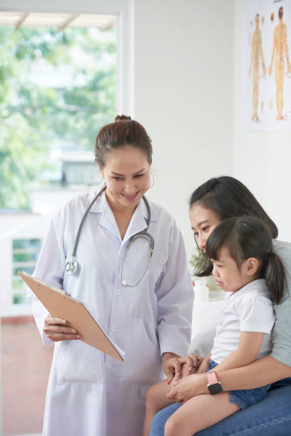 istock Pediatrician showing prescription 1077909420