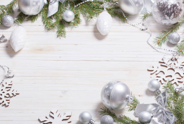 istock Silver Christmas decoration on wooden background 1077911510
