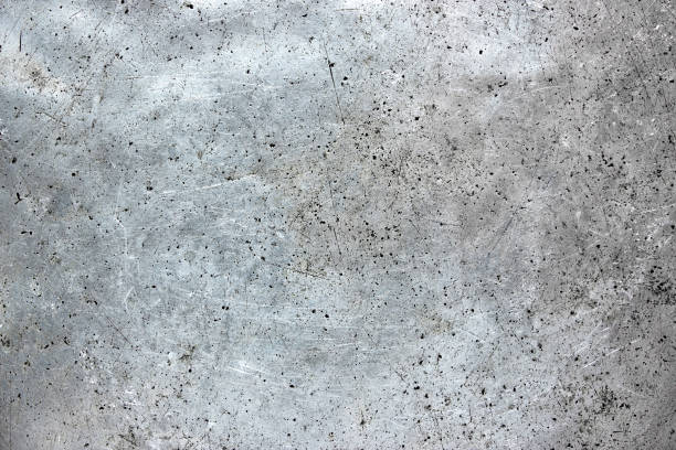 istock Metal plate silvery as a background, worn aluminum texture 1077914418