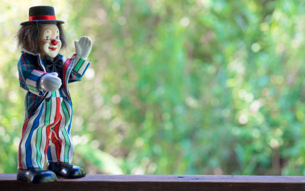 istock Funny clown toy in nature background 1077915882
