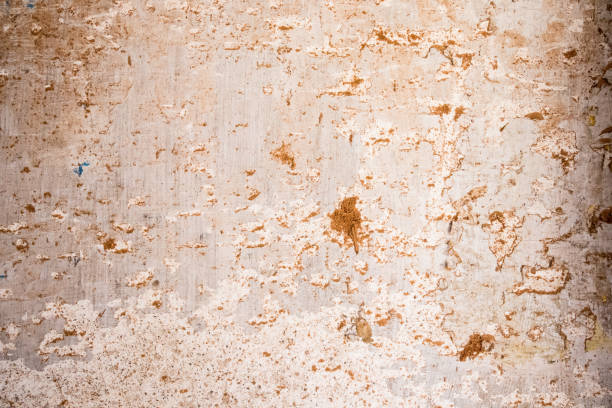 istock old white and very rough cement wall 1077916428