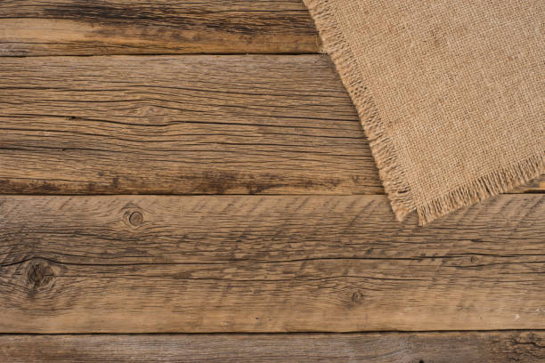 istock Texture of the old burlap and wood. Top view. 1077919084