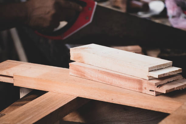 istock wood lumber from sawmill material in carpenter workshop 1077921304