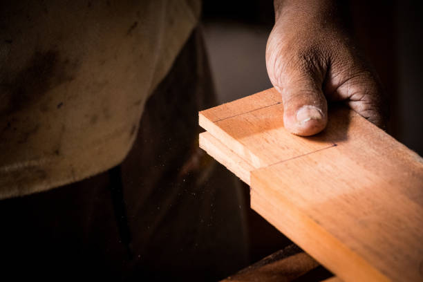 istock Carpenter working on woodworking machines in carpentry shop 1077921378
