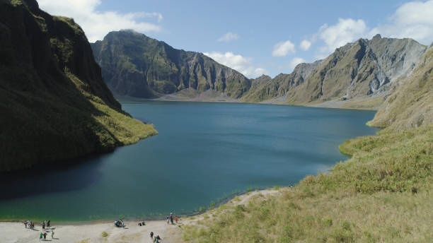 Crater Lake Pinatubo, Philippines, Luzon Crater lake of the volcano Pinatubo among the mountains, Philippines, Luzon. Aerial view beautiful landscape at Pinatubo mountain crater lake. Travel concept zambales province photos stock pictures, royalty-free photos & images