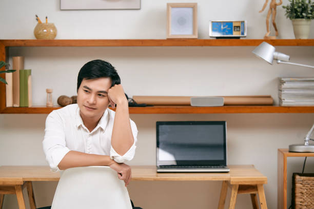 istock Pensive businessman at office 1077938926