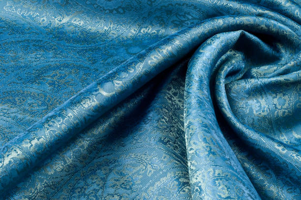 istock Background texture, pattern. Blue paisley silk chiffon mod fabric by the yard. Crinkled, flowy, soft, very light, 1077946812