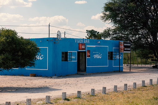 NAMIBIA, MURURANI, MAY 12: Traditional african pub painted to blue color in small village Mururani in northern Namibia near city Rundu. May 12, 2018, Namibia