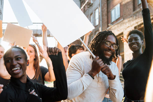 istock Happy activists marching through the city 1077957308