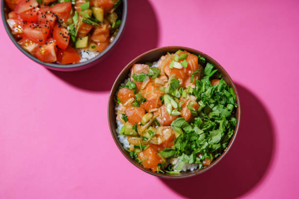istock Poke bowl with marinated salmon and vegetable salad on rice 1077958140