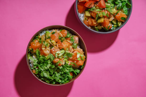 istock Poke bowl with marinated salmon and vegetable salad on rice 1077958154