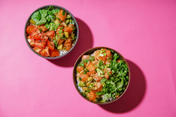 istock Poke bowl with marinated salmon and vegetable salad on rice 1077958156