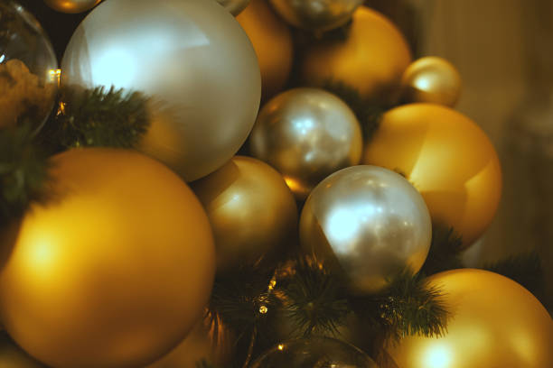 istock Silver and gold Christmas balls on a fur-tree 1077960628