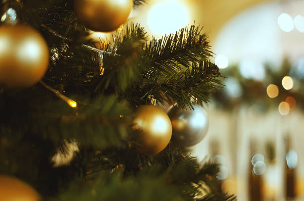 istock Silver and gold Christmas balls on a fur-tree 1077960650