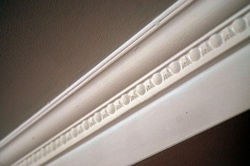 White plinth on the ceiling of drywall