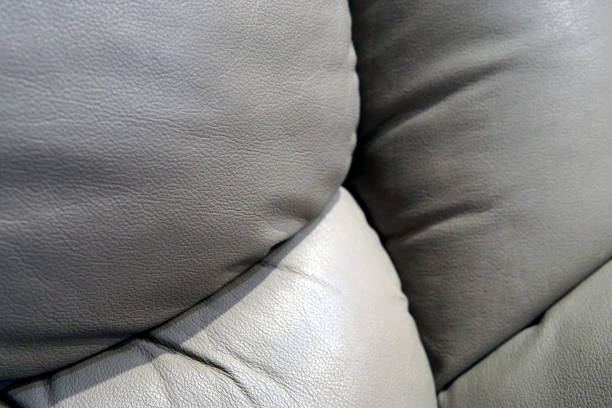 istock Leather sofa cushions close up photo 1077962554
