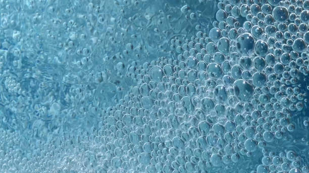 istock Transparent Air Bubbles On Blue Water Background 1077962626