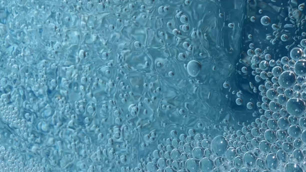 istock Transparent Air Bubbles On Blue Water Background 1077962632