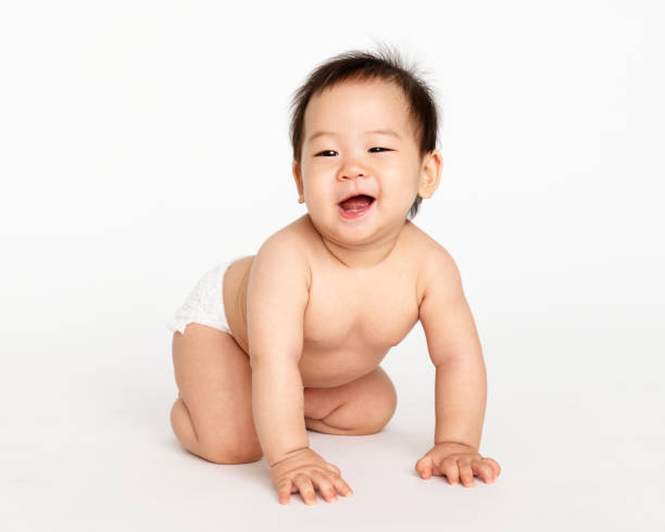 istock Little baby crawling on the floor 1077962710
