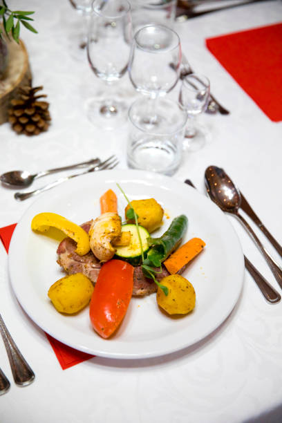 istock A portion of meat with vegetables on a decorated table 1077963808
