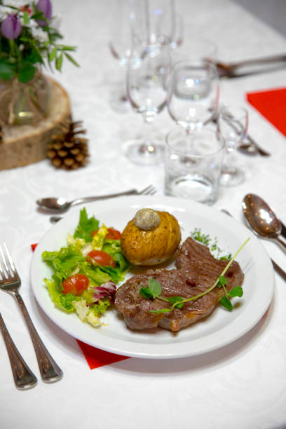 istock A portion of meat with vegetables on a decorated table 1077963944