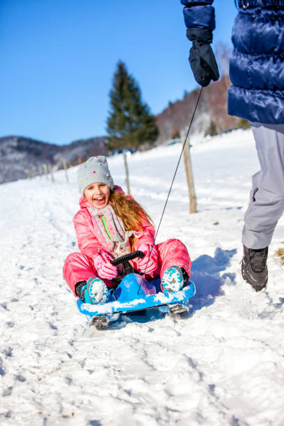 istock Mother and Daughter Enjoyment Together on Snow 1077965572