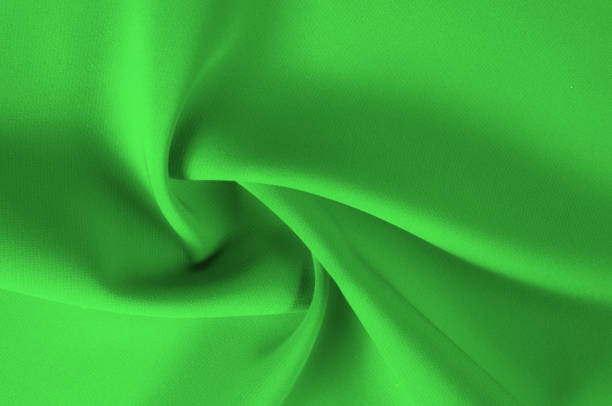istock texture, pattern. Green silk fabric. Presenting this high-quality silk dip made especially for the mood. This gorgeous fabric contains a rich coloring, is super smooth and consists of a clear drapery. 1077966750