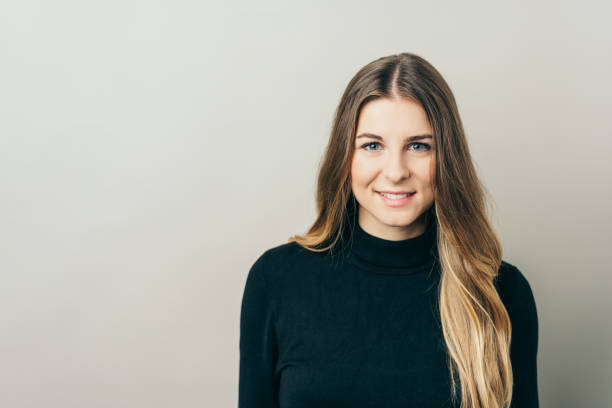 istock Cheerful young woman against plain background 1077969214
