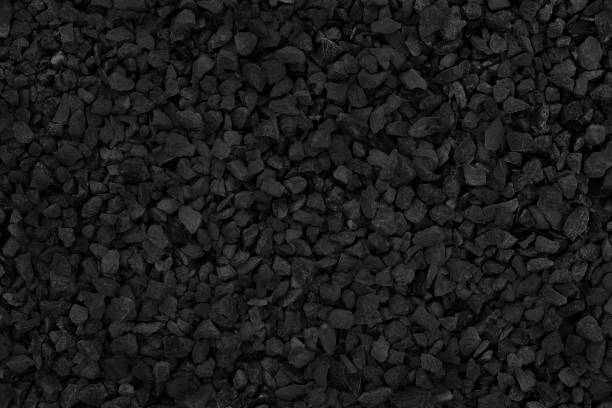 istock Natural stone pattern for background, black and grey stone gravel texture. 1077969236