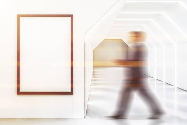 istock Futuristic white lobby, poster, man walks 1077972342