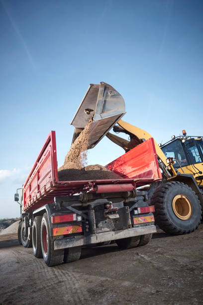 istock Excavator moving sand in a gravel pit 1077975058