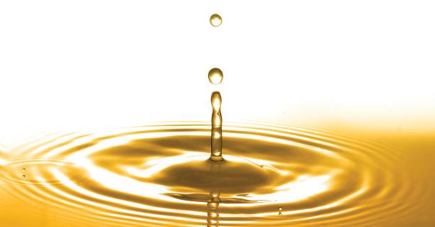 istock Liquid gold or olive oil drop and ripple wave,abstract background 1077975764