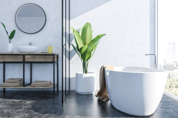 istock White bathroom interior, white tub and sink 1077977930