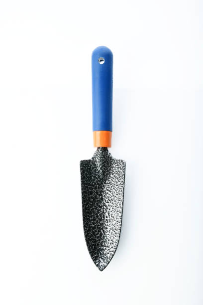 Tools:Top View of a Gardening Trowel Isolated on White Background Shot in Studio. High resolution image of garden trowel with plastic handle shot in studio on white background trowel gardening shovel gardening equipment stock pictures, royalty-free photos & images
