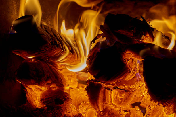 istock Beautiful red flame of fire on oak wood. 1077978058