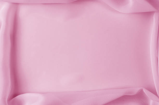 istock Texture, background, pattern. Silk fabric pale pink, abstract folds 1077978166
