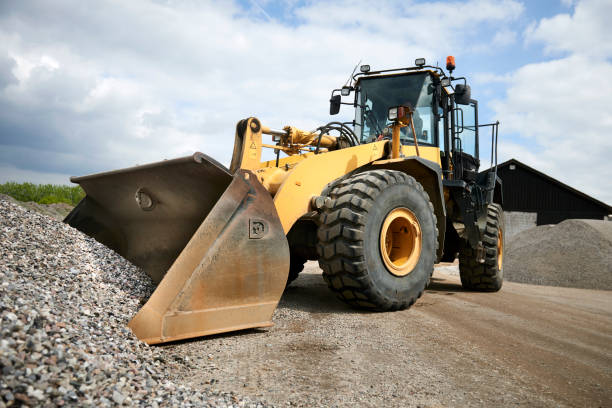 istock Excavator moving sand in a gravel pit 1077978596