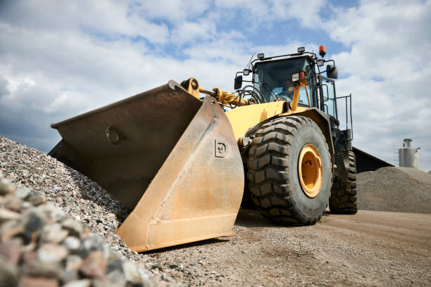 istock Excavator moving sand in a gravel pit 1077978626
